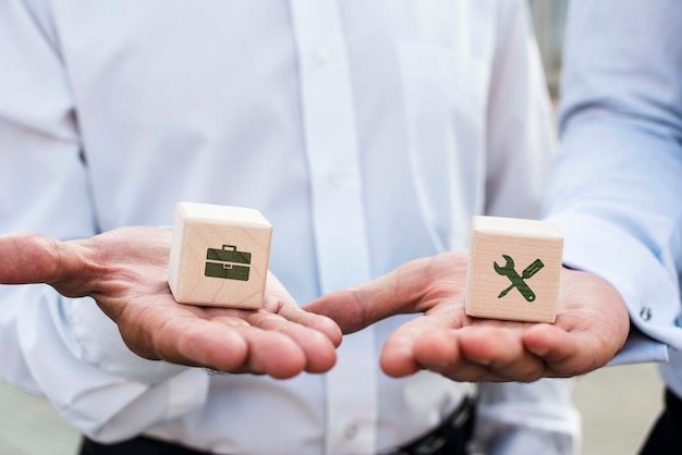 Businessmen holding dices with company ideas