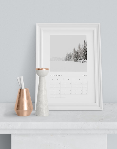 PSD calendar in painting frame on table