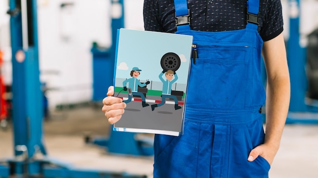 Car mechanic holding cover mockup