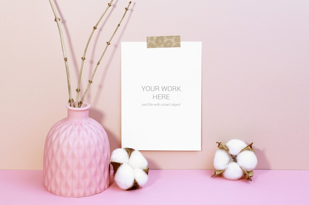 Card mockup on wall with cotton flowers