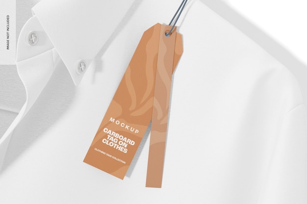 Cardboard tag on clothes mockup, top view