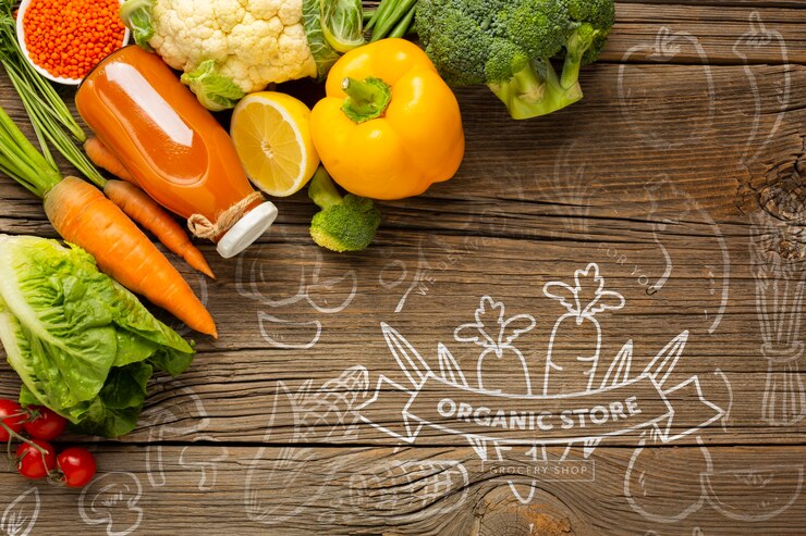 PSD carrot juice and vegetables on wooden table