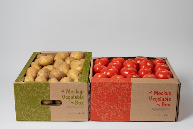 PSD carton boxes with potatoes and tomatoes high angle