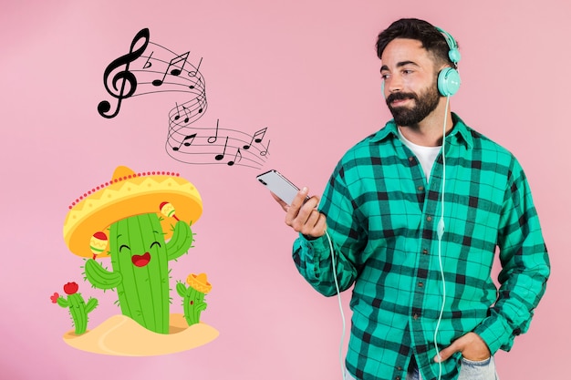 Casual young man listening music at his cell phone next to hand drawn signs