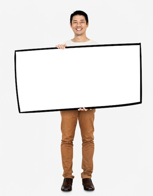 Cheerful man showing a blank white banner