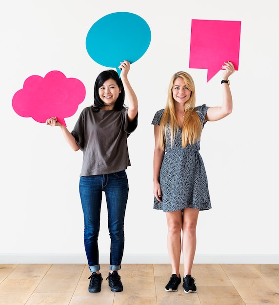 PSD cheerful people holding speech bubble icon