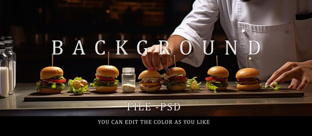 Chef finishing decorating burgers on table