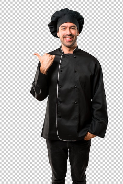 Chef uomo in uniforme nera che punta al lato con un dito per presentare un prodotto