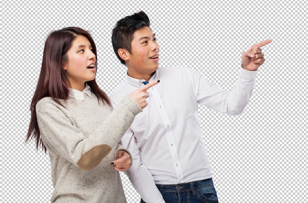 chinese couple pointing copyspace