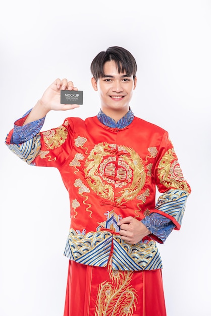 Chinese man hold blank credit card Mockup