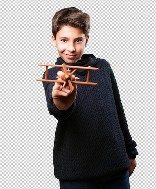 PSD chłopiec z drewnianym samolotem na bielu