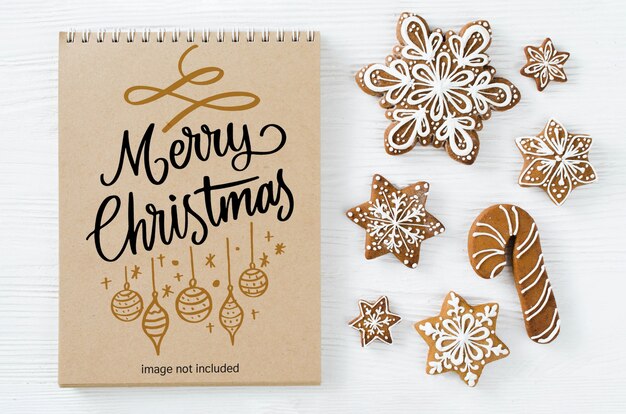 PSD christmas background with brown notebook mockup and gingerbread cookies