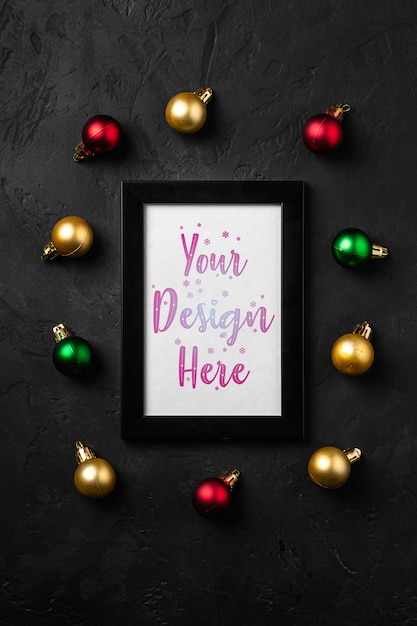 PSD christmas composition with empty picture frame. colorful ornament decorations. mock up greetings card template