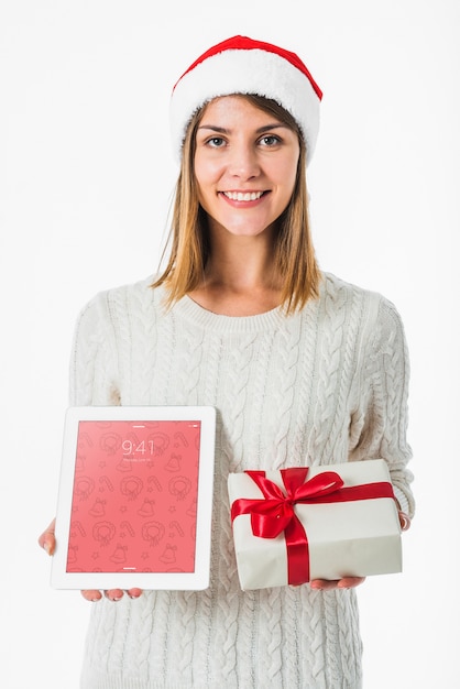 christmas concept with woman holding tablet mockup