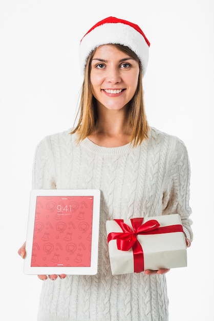 Christmas concept with woman holding tablet mockup