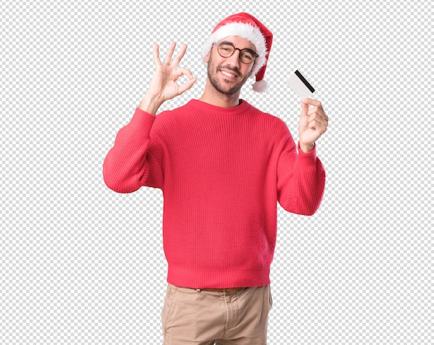 クリスマスのコンセプト - 若い男が身振りで示す
