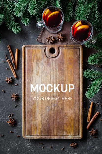 Christmas culinary mockup with cutting board and mulled wine. Top view with copy space