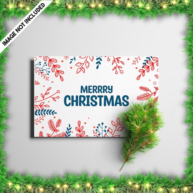 Christmas greeting card mockup template with pine brunches and leaf