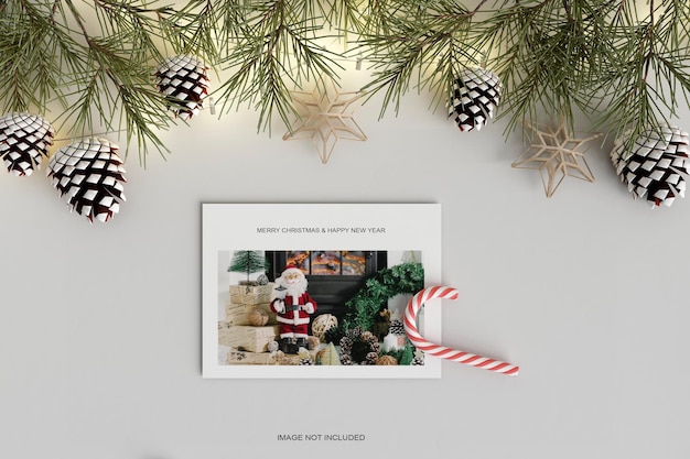 Christmas holiday greeting design with candy and pine leaf mockup