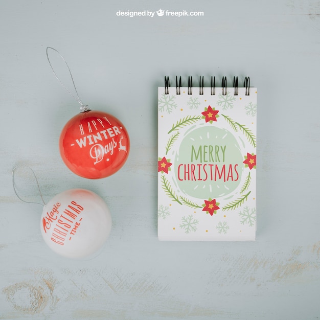 Christmas mockup with notepad and balls