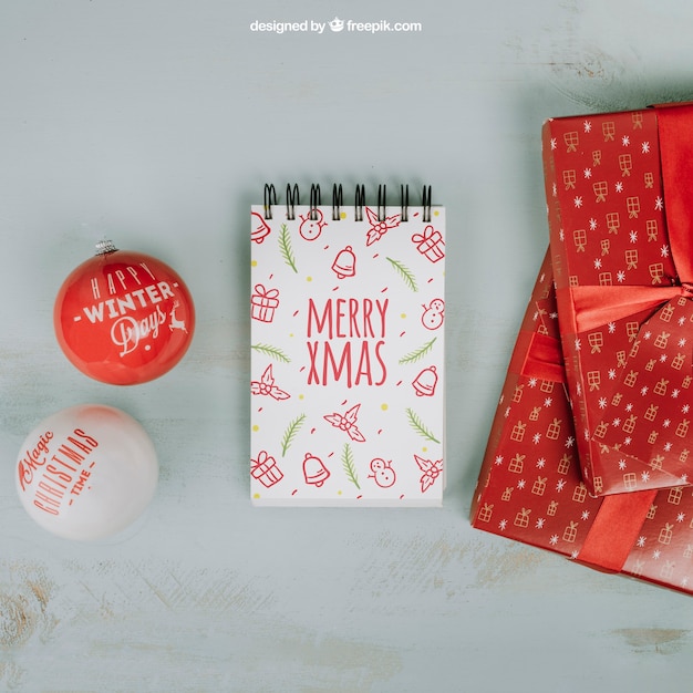 christmas mockup with notepad and gift boxes