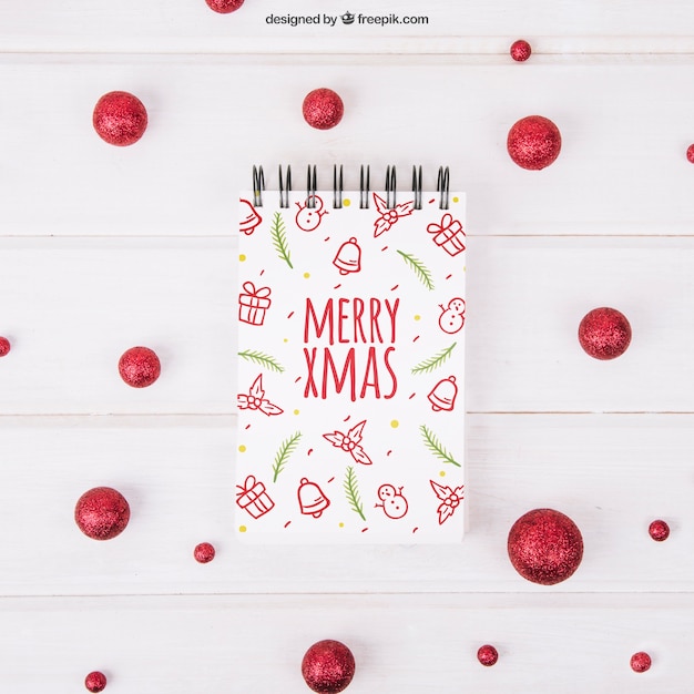 christmas mockup with notepad and red balls