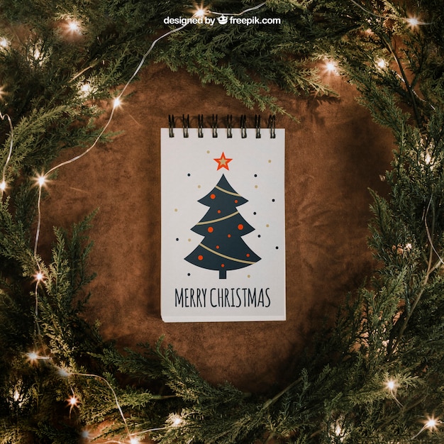 PSD christmas mockup with notepad and string lights