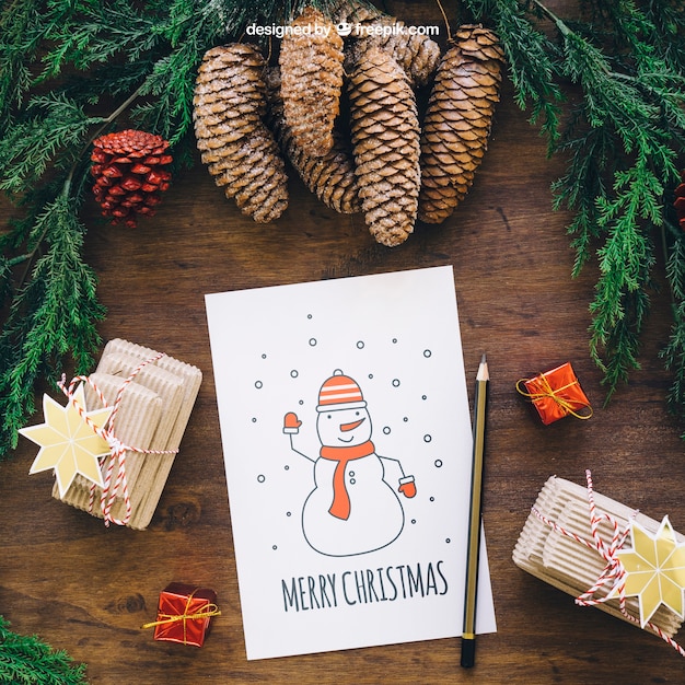 christmas mockup with pine cones and card