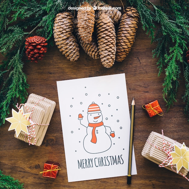 Christmas mockup with pine cones and card