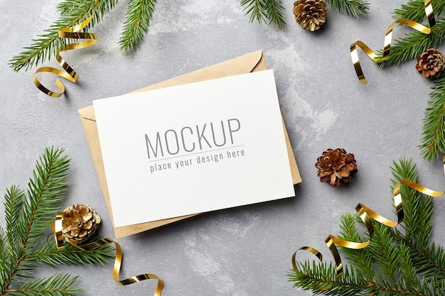 Christmas and New Year greeting card mockup with envelope and gold festive decorations