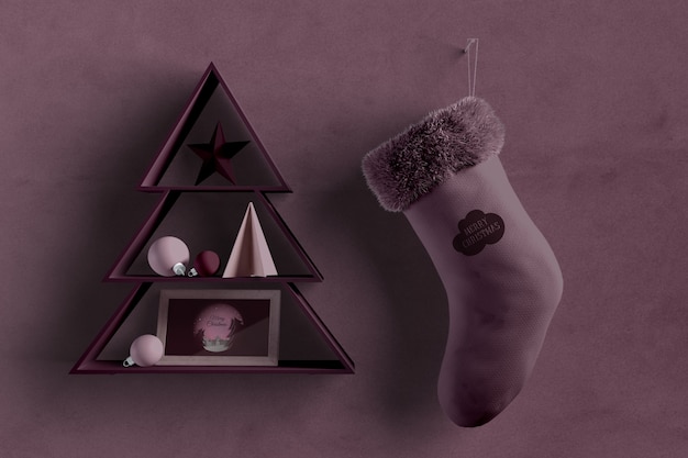 PSD christmas tree shape on wall with sock beside