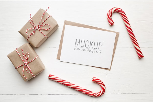 PSD christmas wish card mockup with gift boxes and candy canes