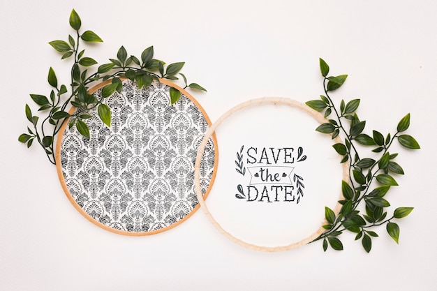 circular frames with leaves save the date mock-up
