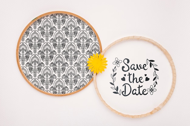 Circular frames with yellow flower save the date mock-up