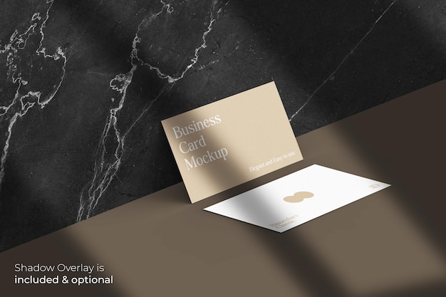 PSD classic elegant business card mockup with shadow overlay on marble wall