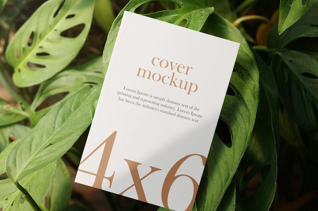 Clean minimal book 4x6 mockup floating on plant