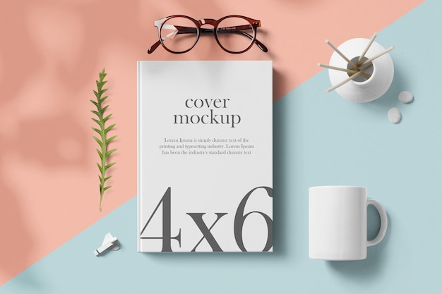 Clean minimal book 4x6 mockup on pink and blue background with glasses vase mug and wooden rocket