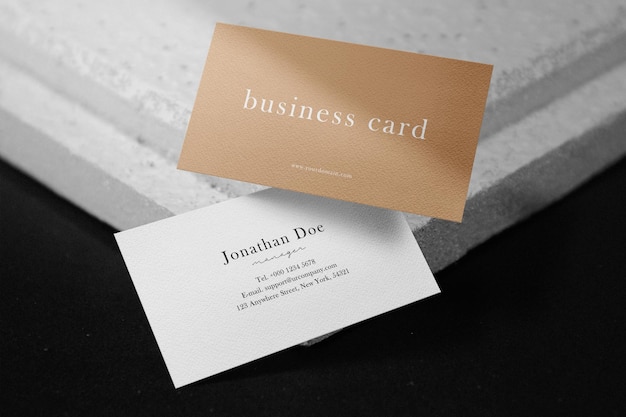 Clean minimal business card mockup floating on plate background. psd file.