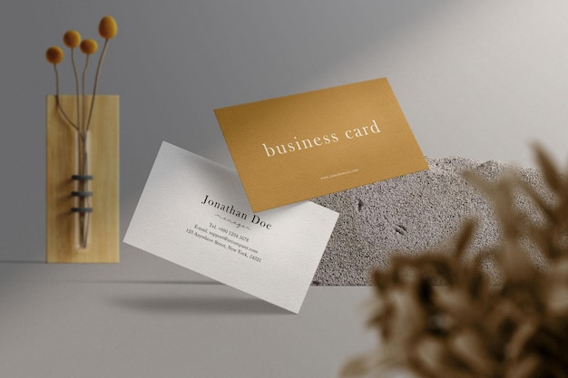 Clean minimal business card mockup floating with block and leaves