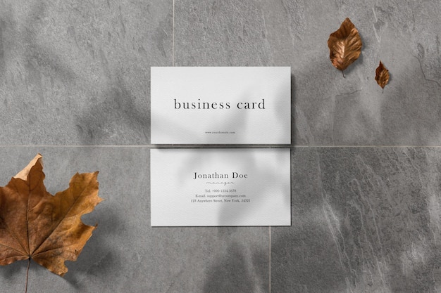 Clean minimal business card mockup on stone floor