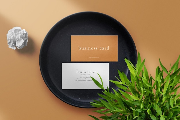 Clean minimal business card mockup on white fablic and clay plate