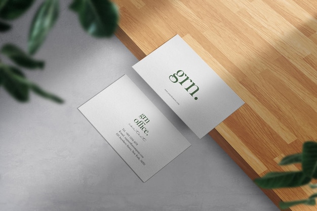 Clean minimal business card mockup on wood ground 