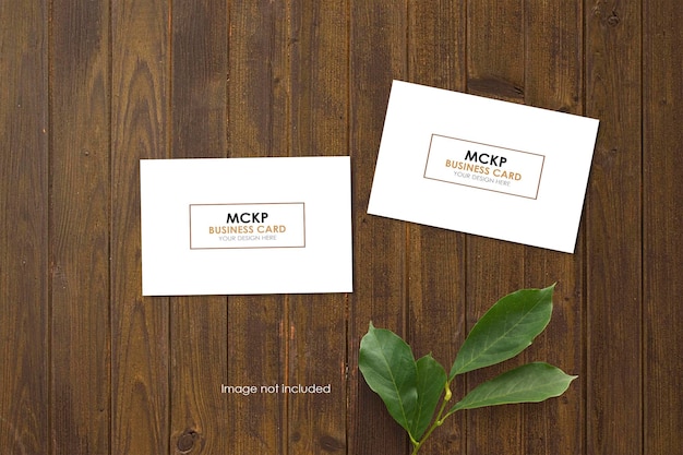 Clean minimal business card mockup on wooden flooring