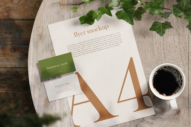 Clean minimal business card and paper A4 mockup on wooden table with plant