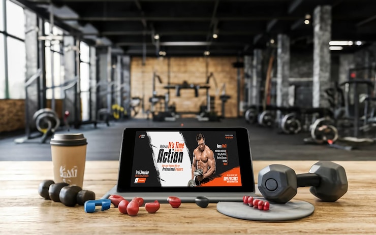PSD clean mockup photo of a black tablet with a gym background