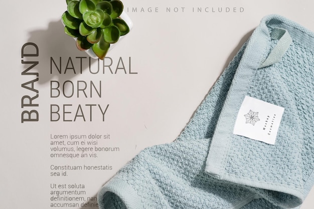 Clean and soft towel with flower pot on grey