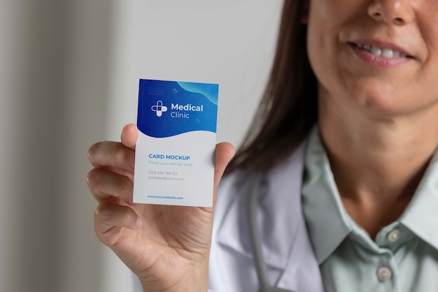 PSD clinic doctor holding business card mockup