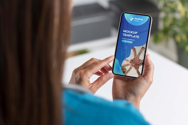 PSD clinic doctor holding phone mockup