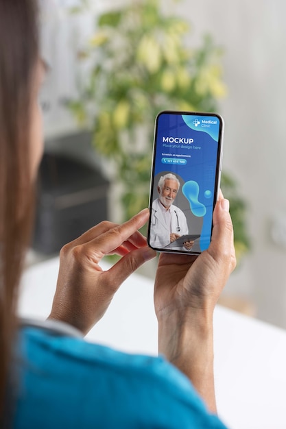 PSD clinic doctor holding phone mockup