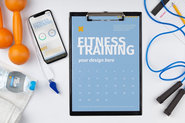 Clipboard mockup med sortiment af træningsudstyr
